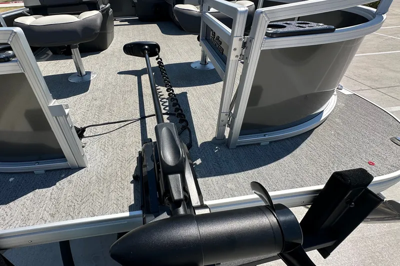 Slide: The Image of 2026 Sun Tracker Bass Buggy 16 XL Select pontoon boat deck with seating and motor. - 14