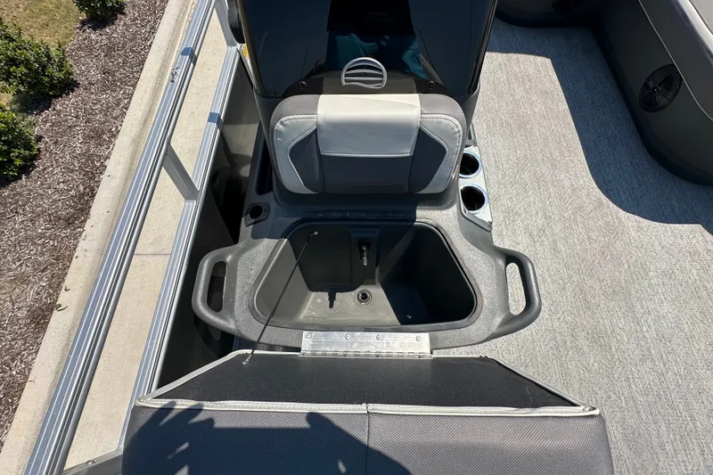 Slide: The Image of 2026 Sun Tracker Bass Buggy 16 XL Select boat interior with storage compartment open. - 18