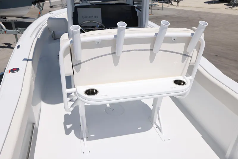 Slide: The Image of 2026 Sea Hunt Ultra 239 SE boat interior with rod holders and cup holders. - 11