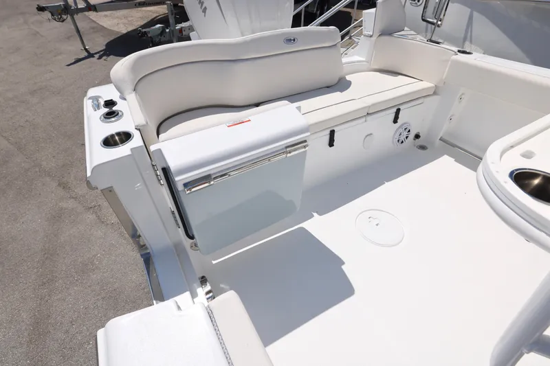 Slide: The Image of 2026 Sea Hunt Ultra 239 SE boat interior with seating and storage features. - 14