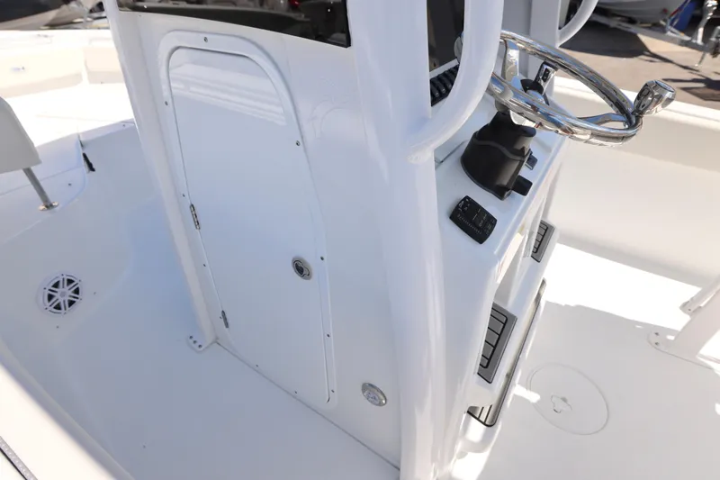Slide: The Image of 2026 Sea Hunt Ultra 239 SE boat console with steering wheel and controls. - 15