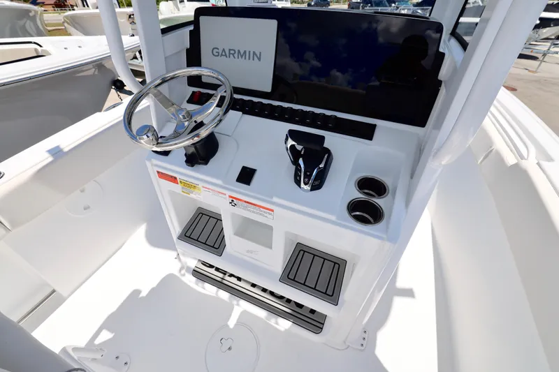 Slide: The Image of 2026 Sea Hunt Ultra 239 SE boat console with Garmin display and steering wheel. - 5