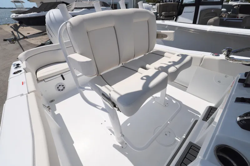 Slide: The Image of 2026 Sea Hunt Ultra 239 SE boat interior with white seating and console. - 8