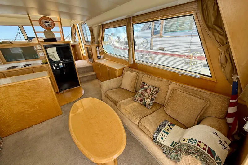 Slide: The Image of Luxurious 1997 Navigator Pilothouse yacht interior with cozy seating and elegant wood finishes. - 10