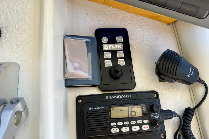 Slide: The Image of Control panel with FLIR joystick and Standard radio on 1997 Navigator Pilothouse. - 24