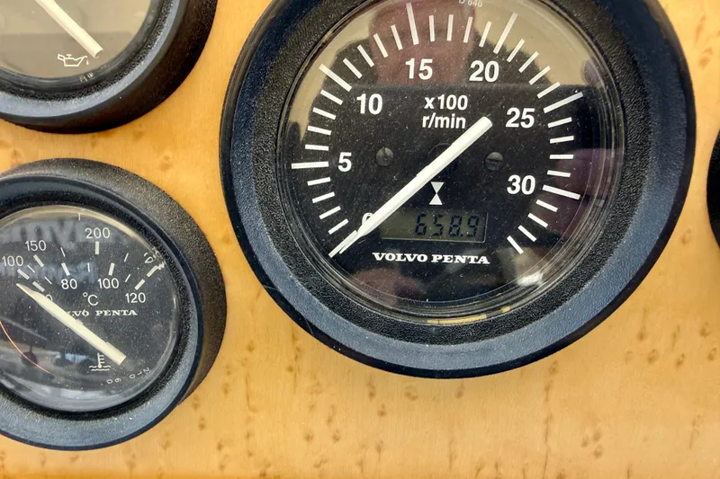 Slide: The Image of Close-up of Volvo Penta gauges on a 1997 Navigator Pilothouse boat dashboard. - 25