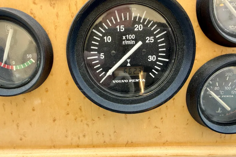 Slide: The Image of Close-up of 1997 Navigator Pilothouse boat gauges, featuring Volvo Penta tachometer. - 26