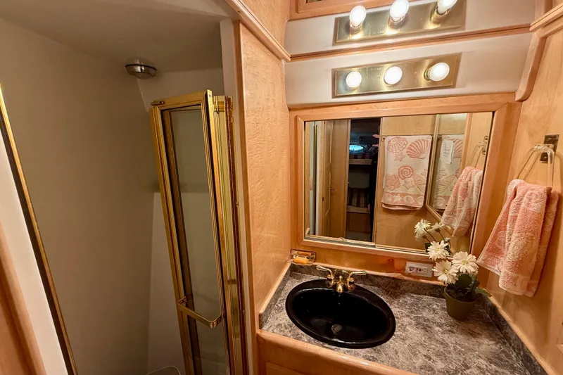 Slide: The Image of Luxurious 1997 Navigator Pilothouse bathroom with elegant fixtures and floral decor. - 41