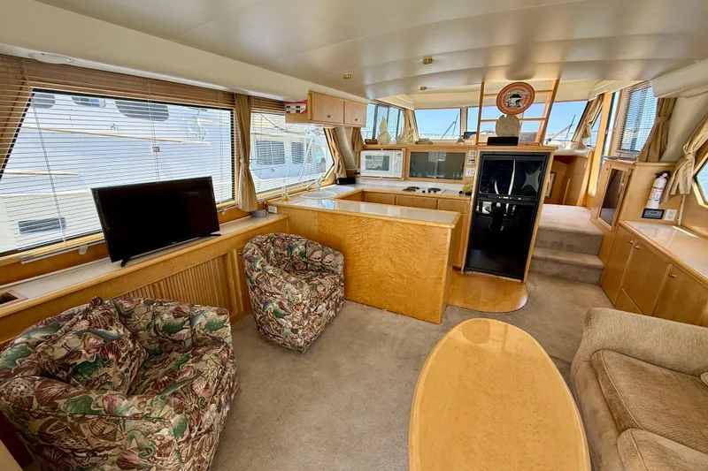 Slide: The Image of Luxurious 1997 Navigator Pilothouse yacht interior with plush seating and modern amenities. - 9