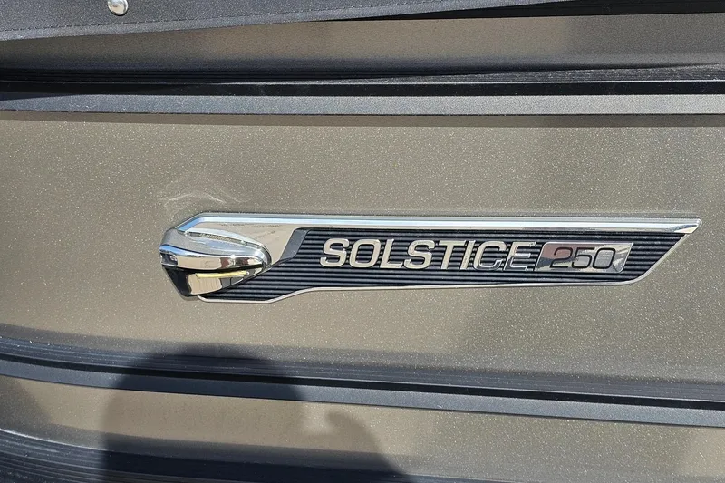 Slide: The Image of 2024 Harris Solstice 250 emblem on metallic surface, showcasing sleek design. - 14