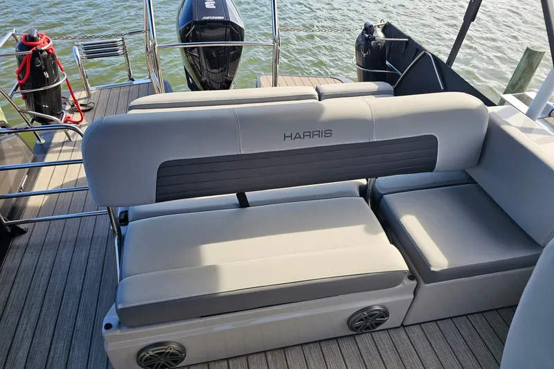 Slide: The Image of 2024 Harris boat seating with gray upholstery, featuring a sleek design and modern amenities. - 17