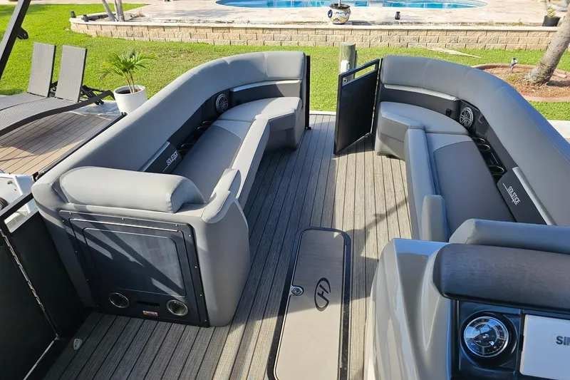 Slide: The Image of Luxurious 2024 Harris boat interior with sleek gray seating and modern design. - 23