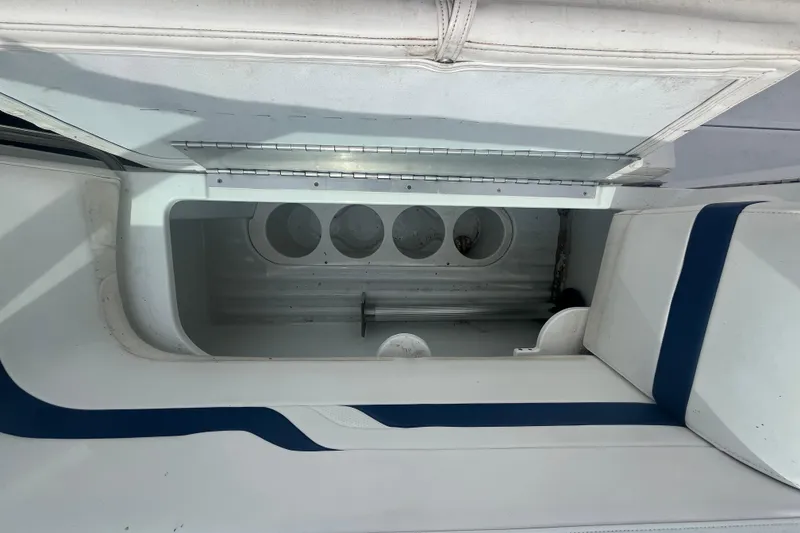 Slide: The Image of Storage compartment of a 2006 Formula 330 Sun Sport boat, featuring cup holders. - 12