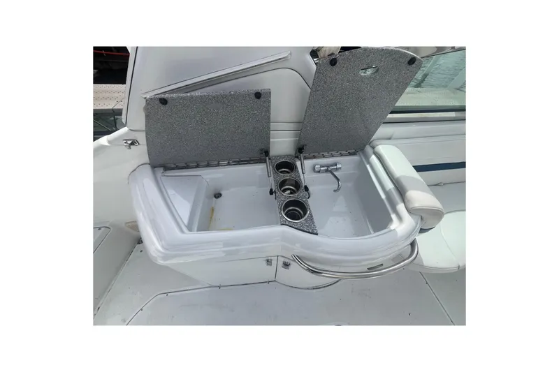 Slide: The Image of 2006 Formula 330 Sun Sport boat sink with cup holders and faucet. - 13