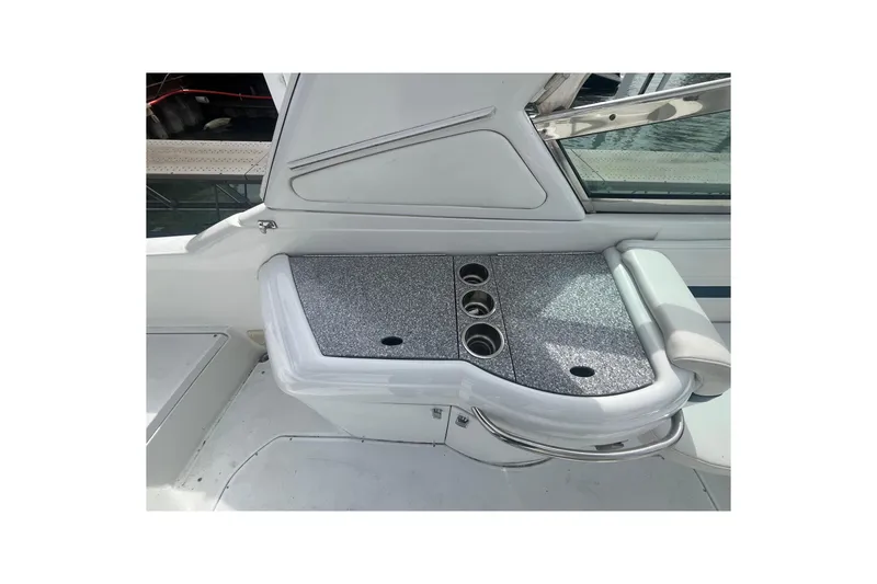 Slide: The Image of 2006 Formula 330 Sun Sport boat interior with cup holders and seating area. - 14