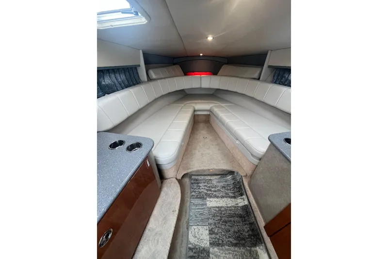 Slide: The Image of Interior of a 2006 Formula 330 Sun Sport boat with plush seating and modern design. - 22