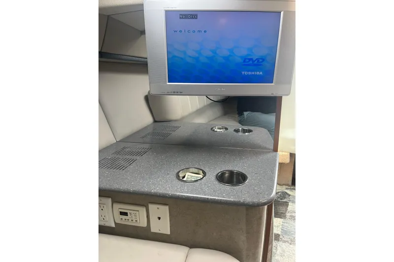 Slide: The Image of Interior of 2006 Formula 330 Sun Sport with Toshiba TV and countertop cup holders. - 23