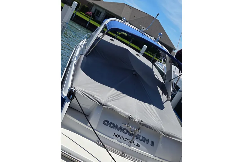Slide: The Image of 2006 Formula 330 Sun Sport boat docked, covered, with Northport, MI registration. - 28