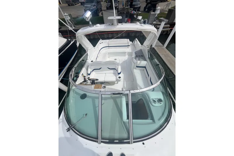 Slide: The Image of 2006 Formula 330 Sun Sport boat with spacious cockpit and sleek design at dock. - 4