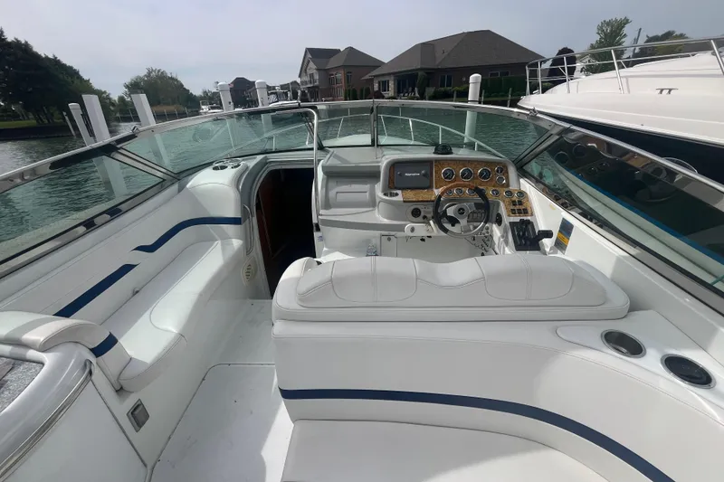 Slide: The Image of 2006 Formula 330 Sun Sport boat interior with white seating and control panel. - 6