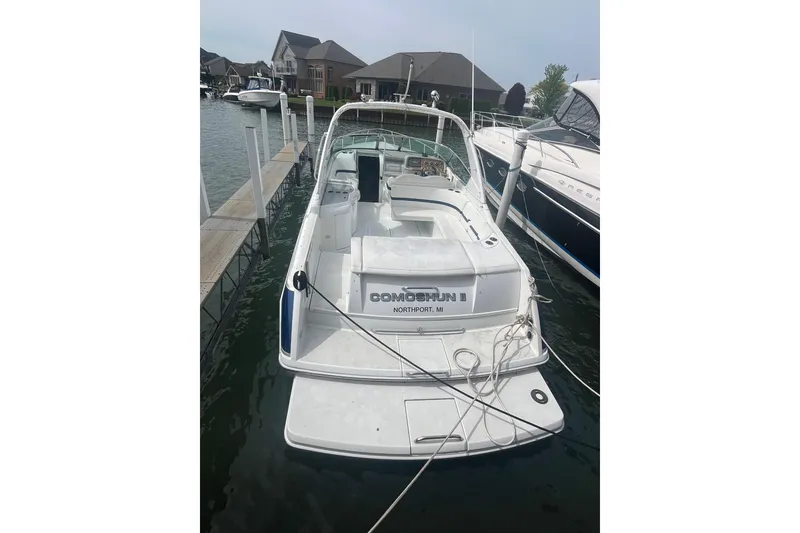 Slide: The Image of 2006 Formula 330 Sun Sport boat docked at marina, rear view. - 8