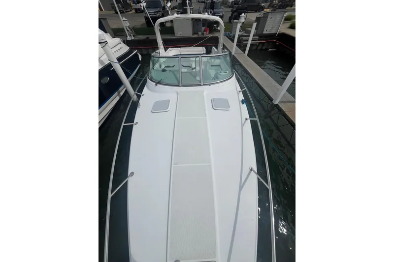 Slide: The Image of 2006 Formula 330 Sun Sport boat docked at marina, top view. - 9