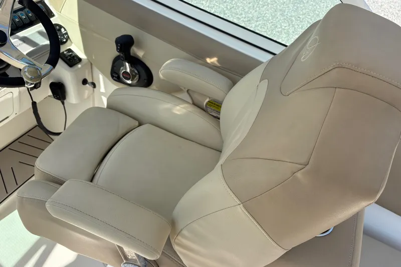 Slide: The Image of Captain's seat and controls of a 2017 Sailfish 245 DC boat. - 13