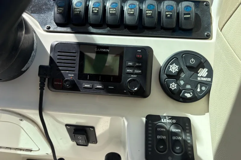 Slide: The Image of Control panel of a 2017 Sailfish 245 DC boat with Garmin and Ultraflex systems. - 17