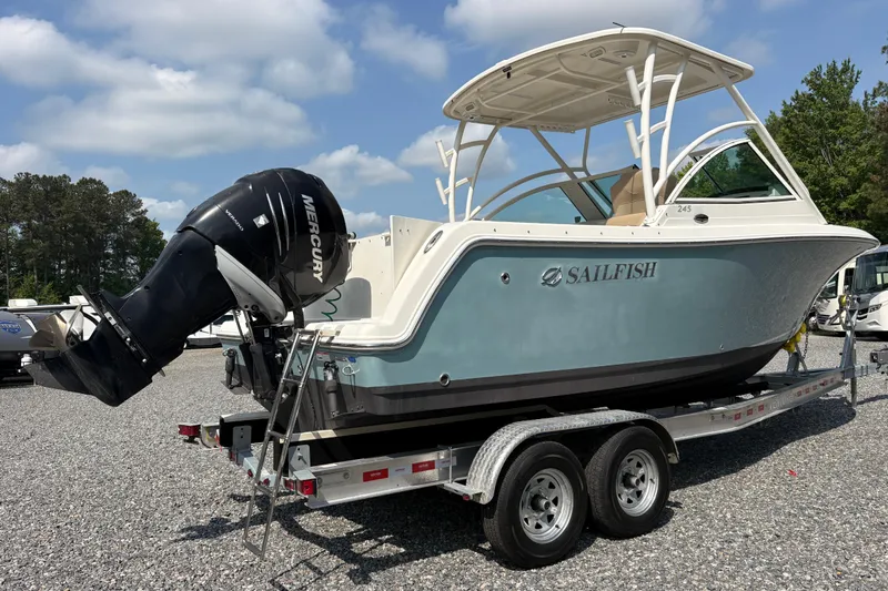 Slide: The Image of 2017 Sailfish 245 DC boat on trailer with Mercury outboard motor. - 27