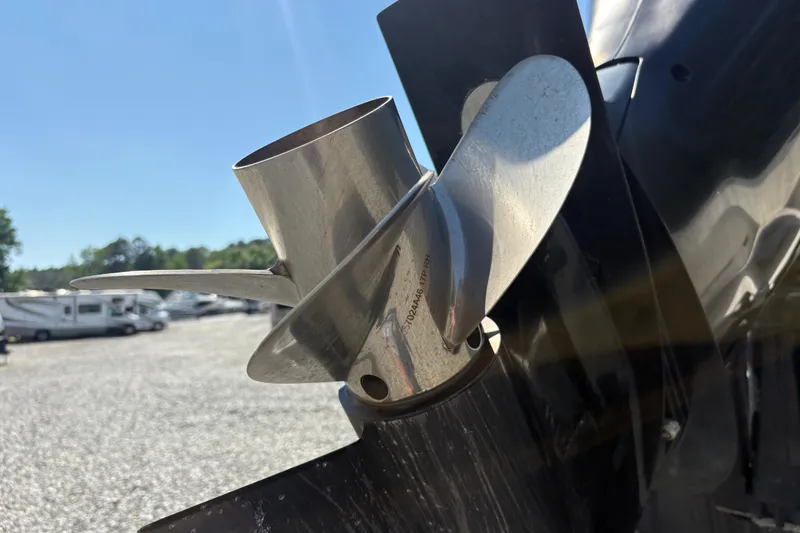 Slide: The Image of Close-up of a 2017 Sailfish 245 DC boat propeller in a sunny outdoor setting. - 3
