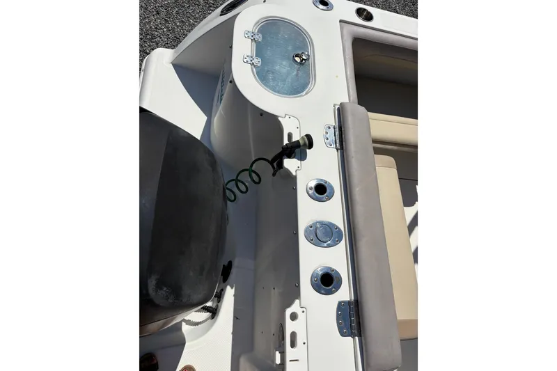 Slide: The Image of Interior view of a 2017 Sailfish 245 DC boat with seating area. - 4
