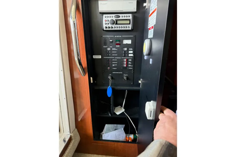 Slide: The Image of Electrical control panel inside a 2007 Sea Ray 290 Sundancer boat cabin. - 16