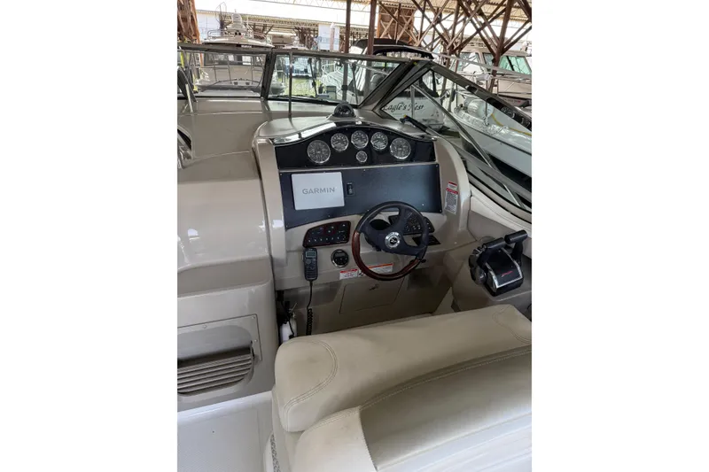 Slide: The Image of 2007 Sea Ray 290 Sundancer helm with Garmin navigation system and control panel. - 6