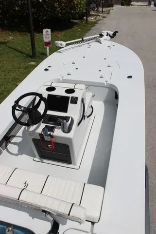 Slide: The Image of 2019 Beavertail Lightning boat with steering console and seating area. - 11