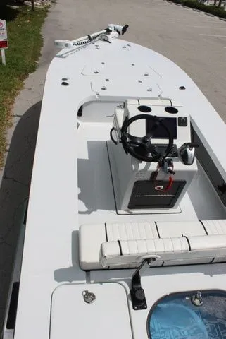 Slide: The Image of 2019 Beavertail Lightning boat with steering console and bench seating. - 12