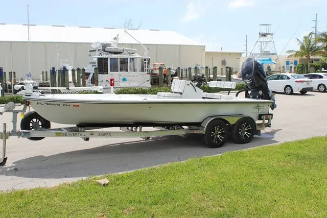 Slide: The Image of 2019 Beavertail Lightning boat on trailer parked at marina. - 3