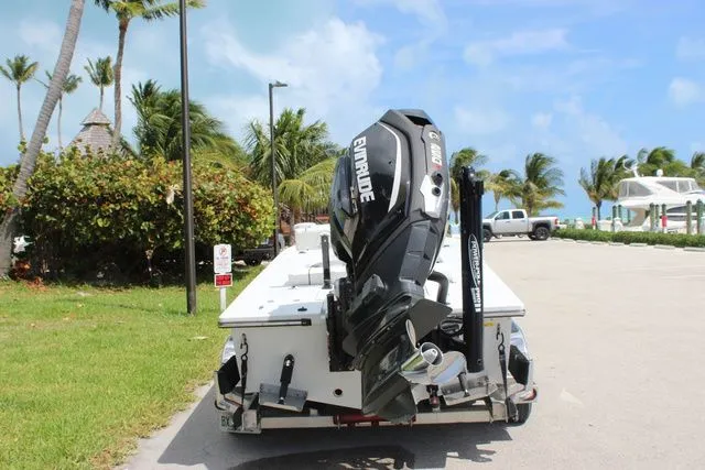 Slide: The Image of 2019 Beavertail Lightning boat with Evinrude motor parked near beach. - 7