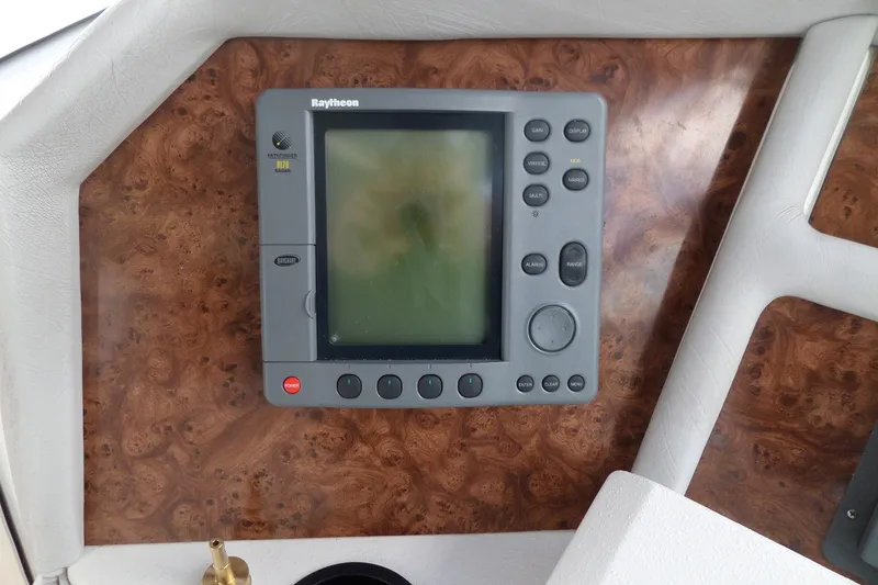 Slide: The Image of Raytheon marine navigation system on 1994 Sea Ray 370 Express Cruiser dashboard. - 17
