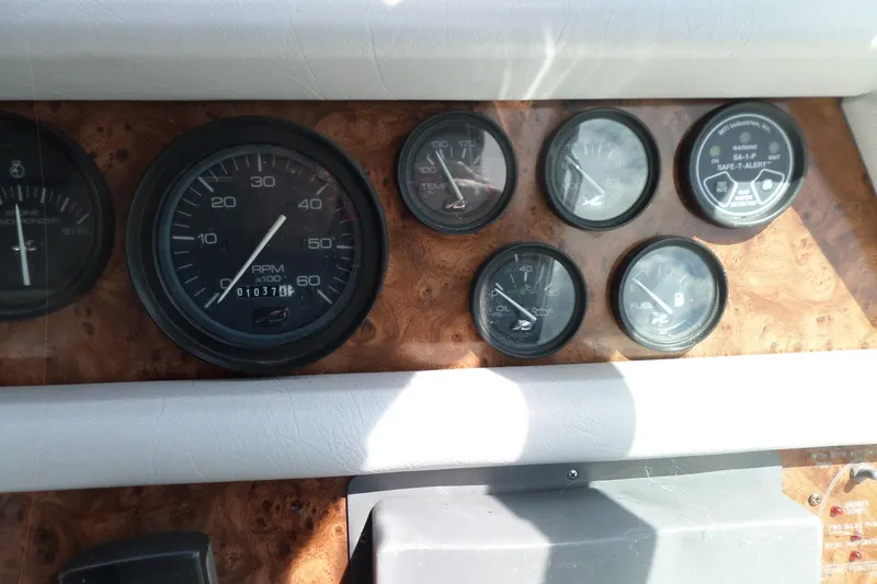 Slide: The Image of Dashboard gauges of a 1994 Sea Ray 370 Express Cruiser boat. - 19