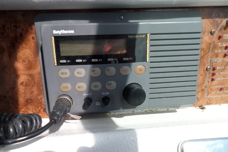 Slide: The Image of Raytheon RAY201 VHF radio on 1994 Sea Ray 370 Express Cruiser dashboard. - 23