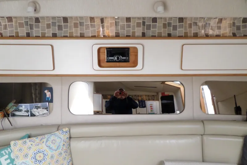 Slide: The Image of Interior of 1994 Sea Ray 370 Express Cruiser with modern decor and comfortable seating. - 32
