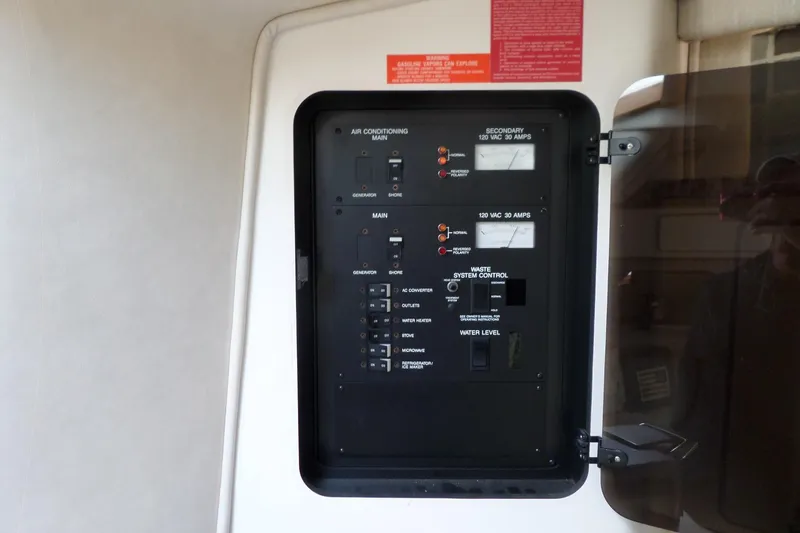 Slide: The Image of Electrical control panel on a 1994 Sea Ray 370 Express Cruiser boat. - 43