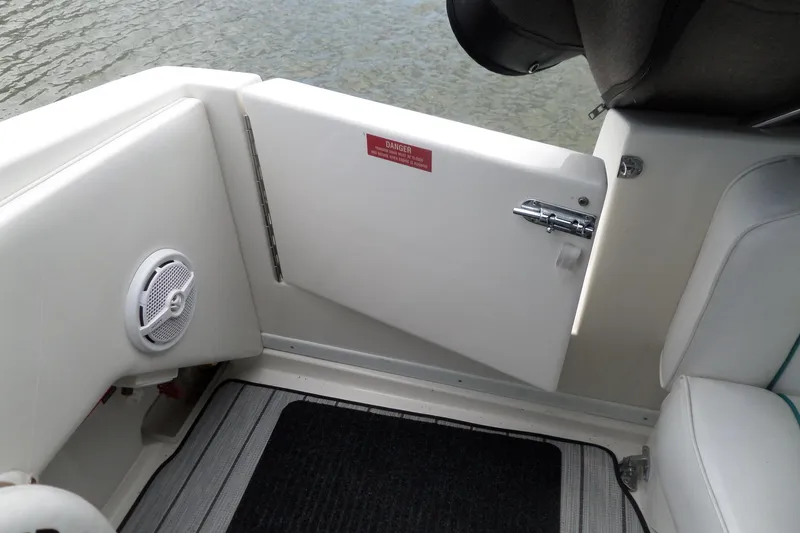 Slide: The Image of 1994 Sea Ray 370 Express Cruiser interior with open door and speaker detail. - 53