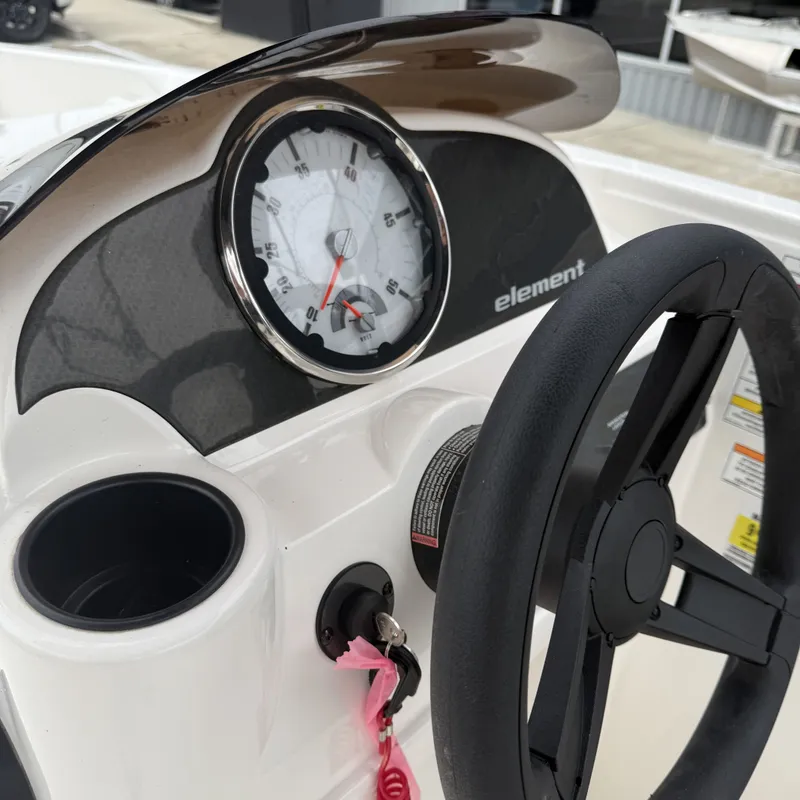 Slide: The Image of Dashboard of 2025 Bayliner E18LE with steering wheel and speedometer. - 17