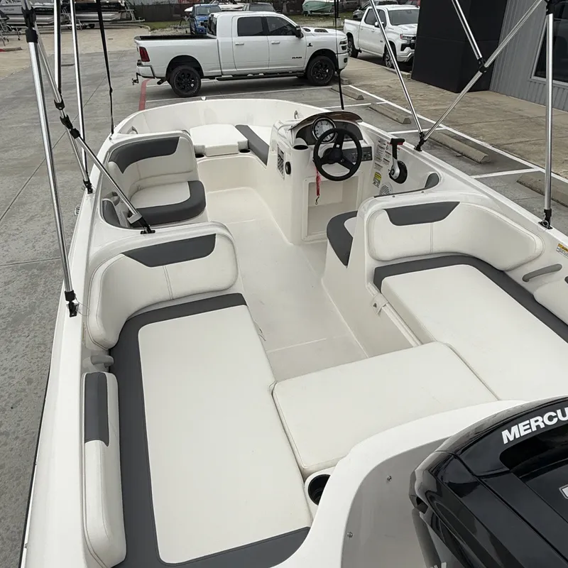 Slide: The Image of Interior of 2025 Bayliner E18LE with gray and white seating. - 8