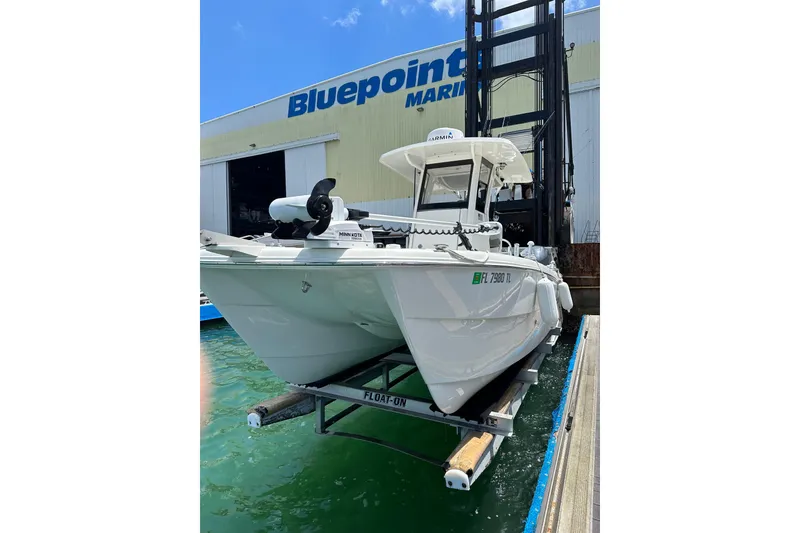 Slide: The Image of 2023 World Cat 235 CC boat at Bluepoint Marina dock. - 7