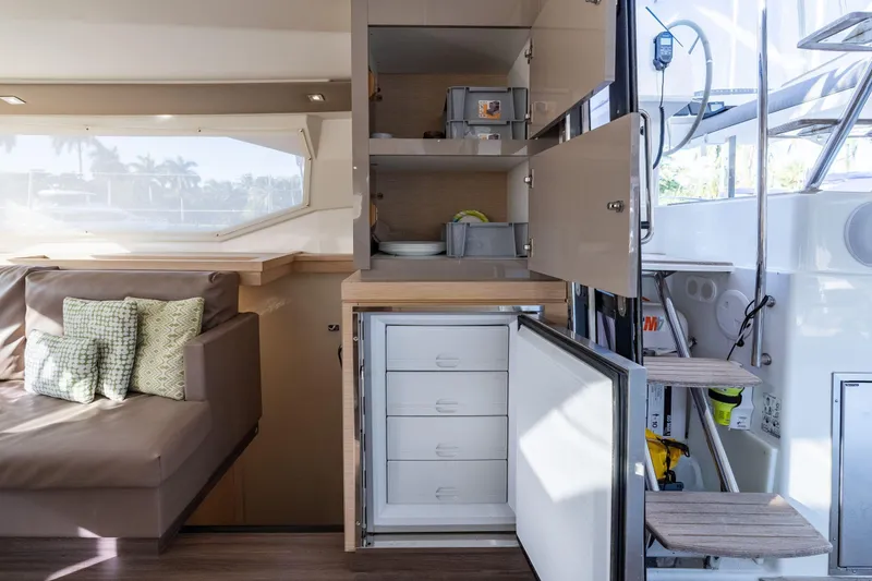 Slide: The Image of Interior of 2019 Fountaine Pajot 47 yacht with seating and storage cabinets. - 30