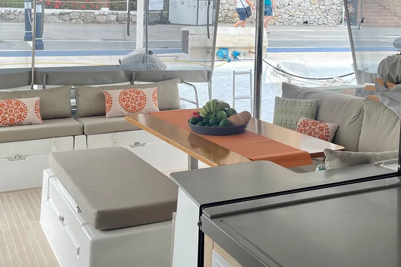Slide: The Image of Luxurious 2019 Saona 47 yacht interior with elegant seating and decorative pillows. - 39