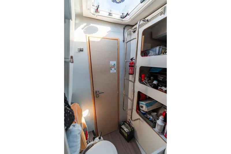 Slide: The Image of 2019 Fountaine Pajot 47 interior with storage shelves and a skylight. - 62