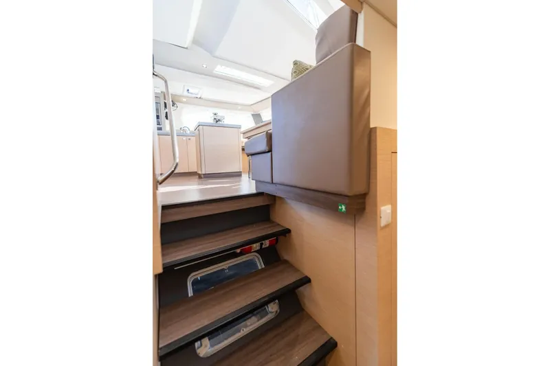 Slide: The Image of Interior of 2019 Fountaine Pajot 47 yacht, featuring modern stairs and sleek design. - 63